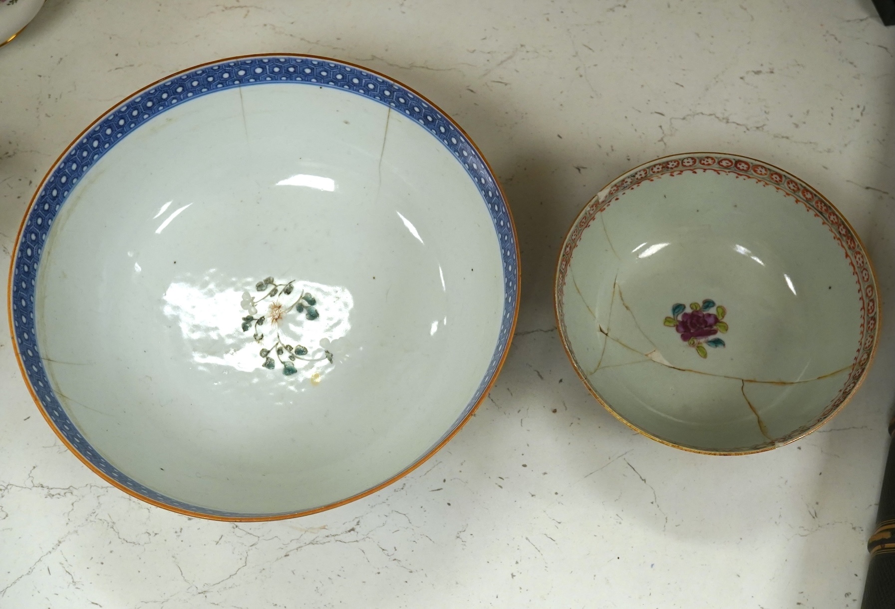 Two 18th century Chinese export famille rose bowls (a.f) largest 26cm diameter. Condition - poor